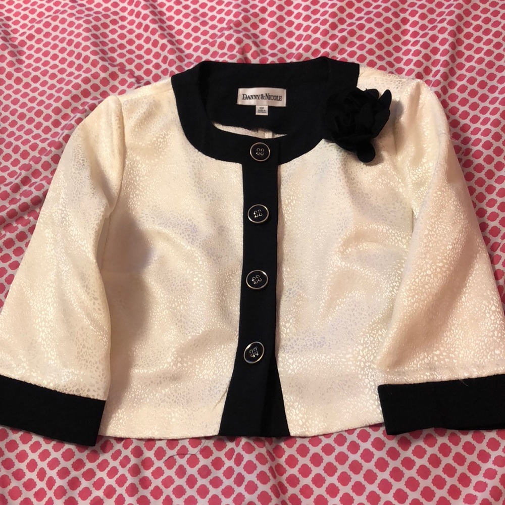 A white/cream colored jacket/shall.